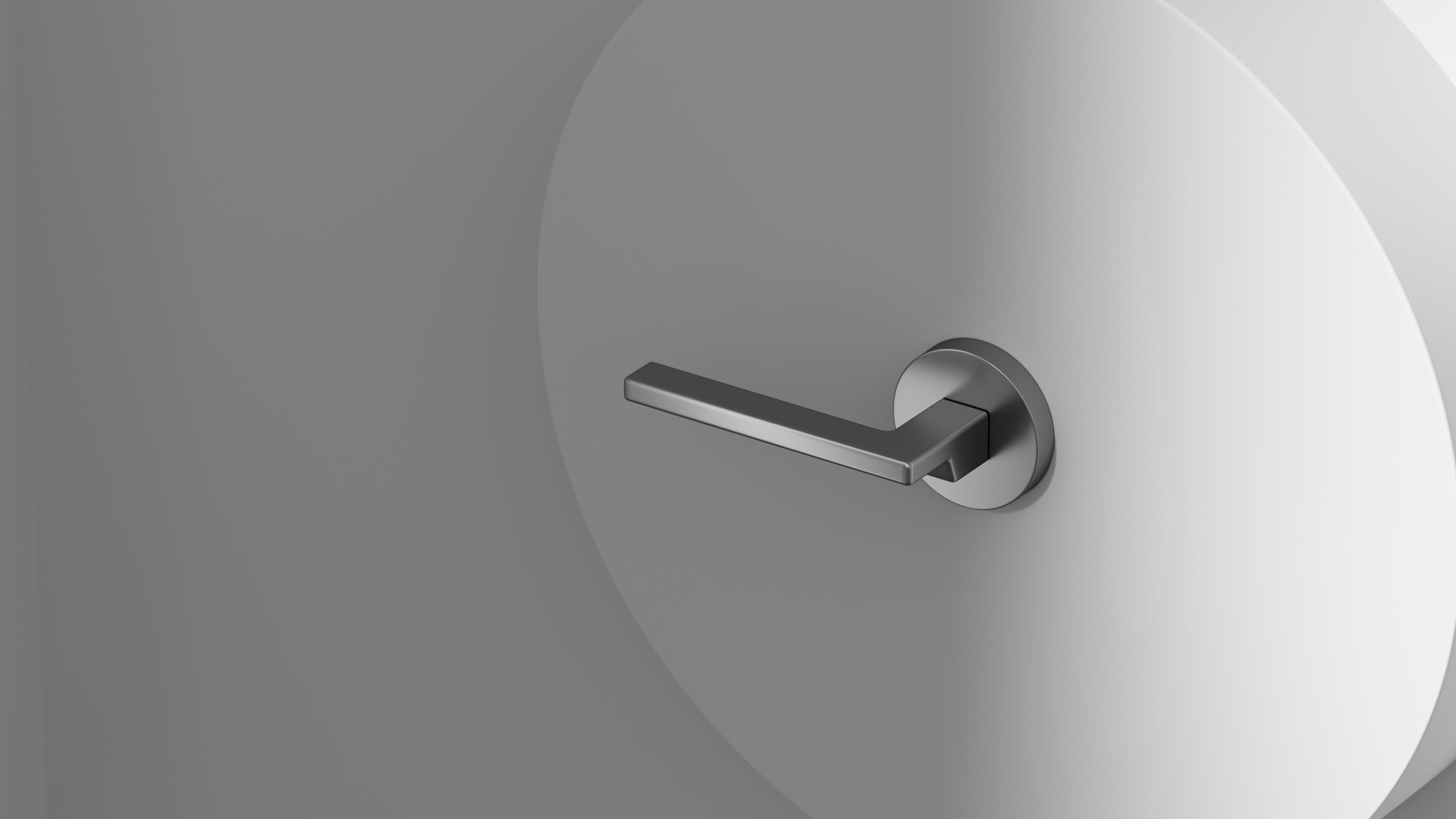 OKUN minimalist passage door lever in matte black on a contemporary interior door