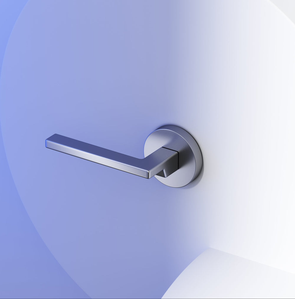 OKUN modern minimalist door handle on an interior door in a designed room